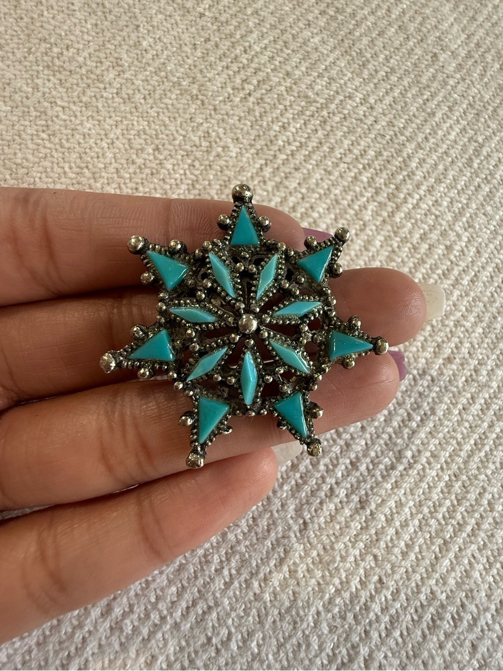 Vintage Avon silver-tone faux-turquoise snowflake starburst brooch.